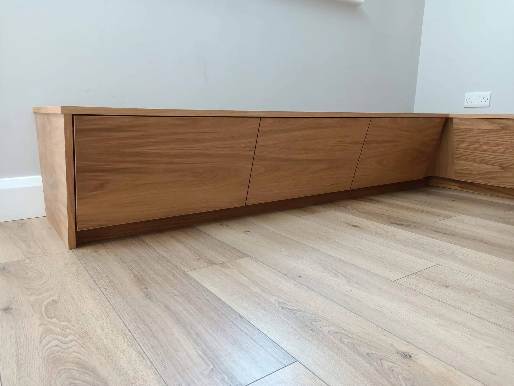 Wide timber fronts beneath the fitted bench seat