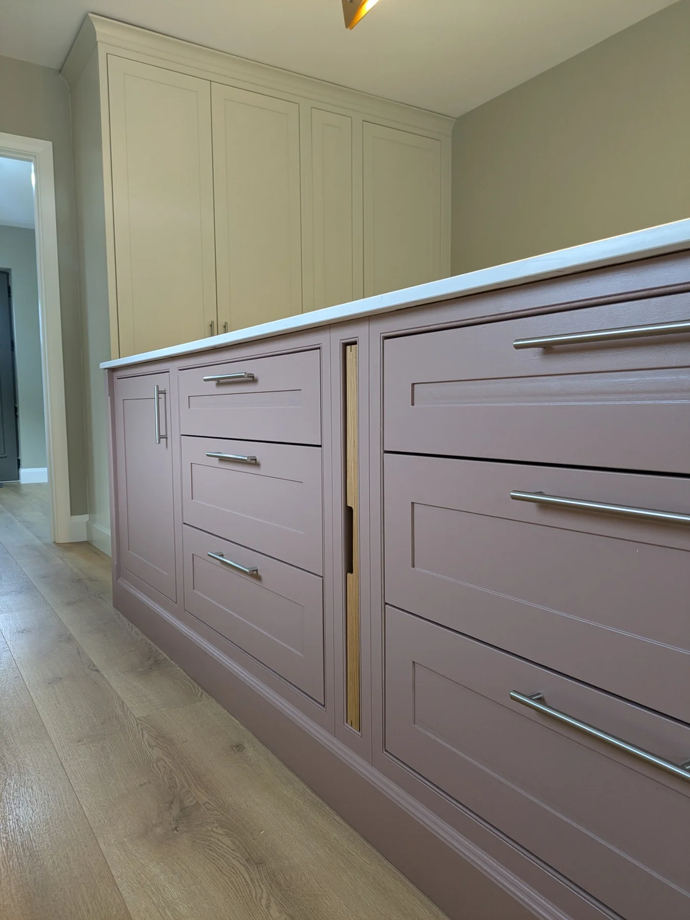 Hand-painted island drawer fronts with beaded detailing and metal handles