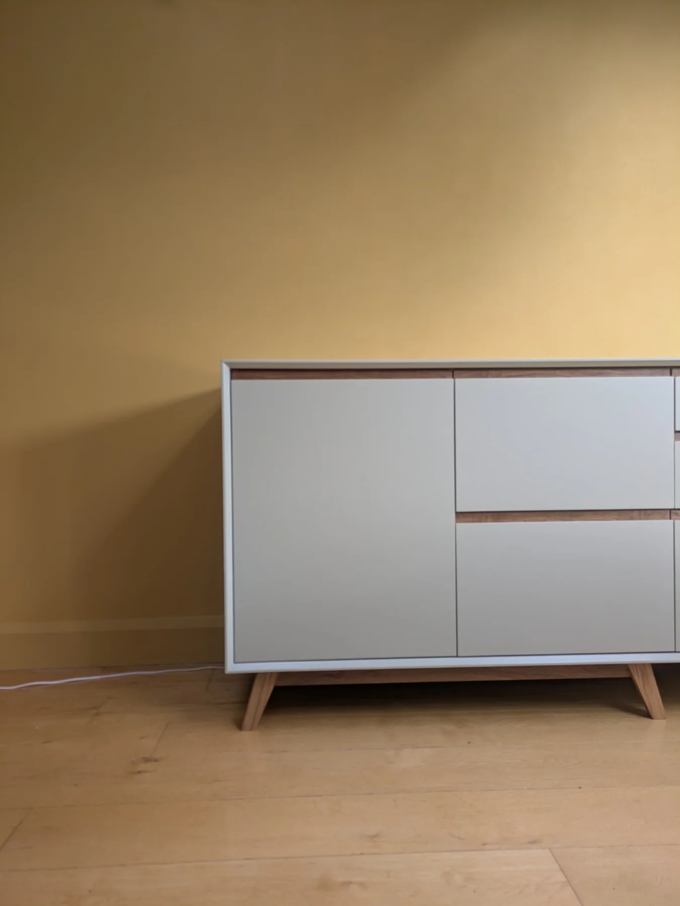 The sideboard cupboard and drawer fronts with an oak reveal between them