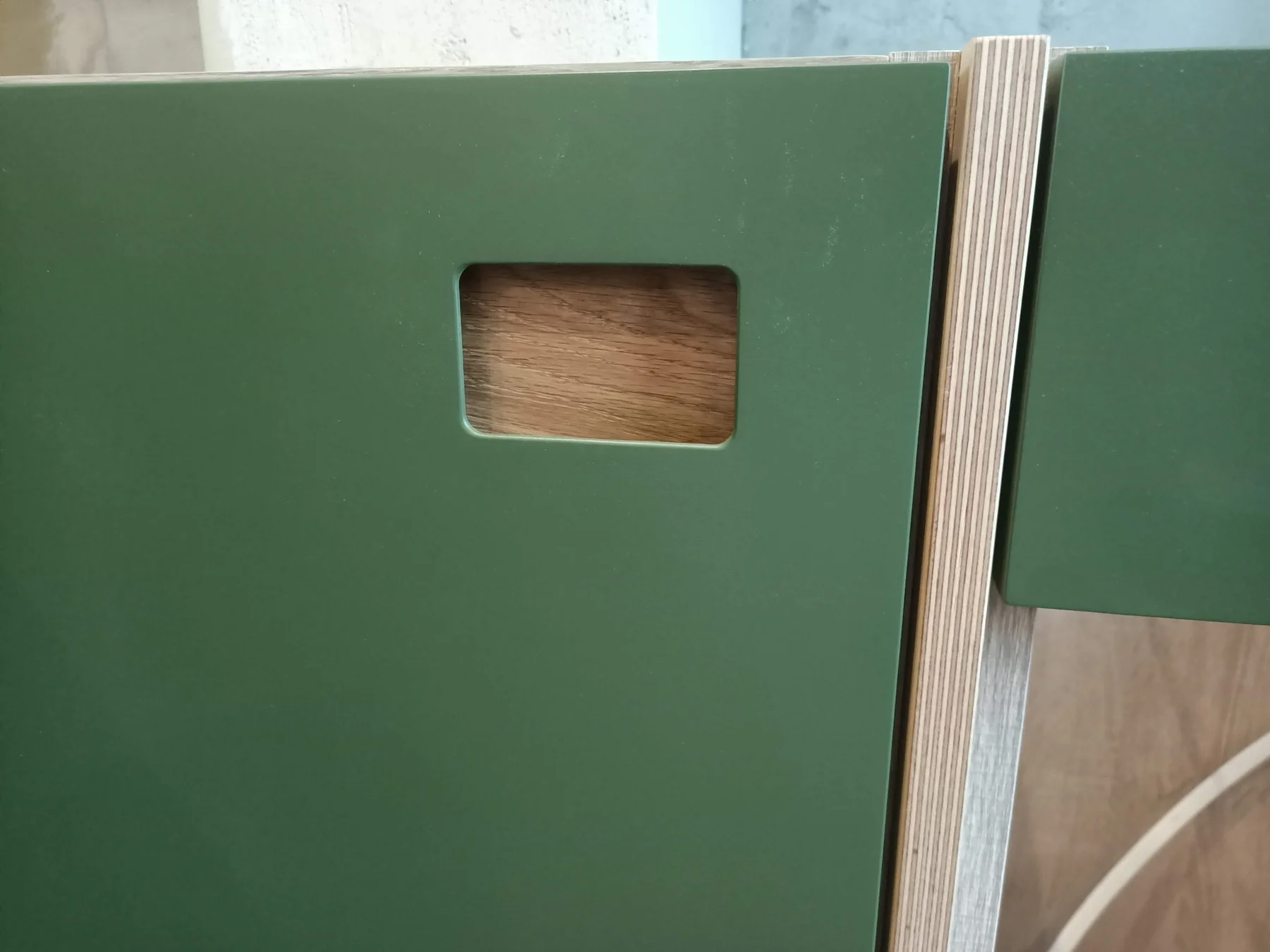 A close view of a painted kitchen front and reeded oak detail